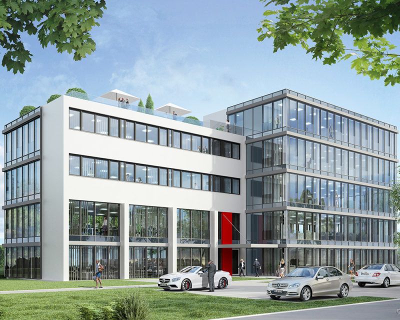 Modernes Bürogebäude mit großen Glasfassaden, weißer Fassade und rotem Eingangsbereich, umgeben von Grünflächen und mehreren parkenden Autos